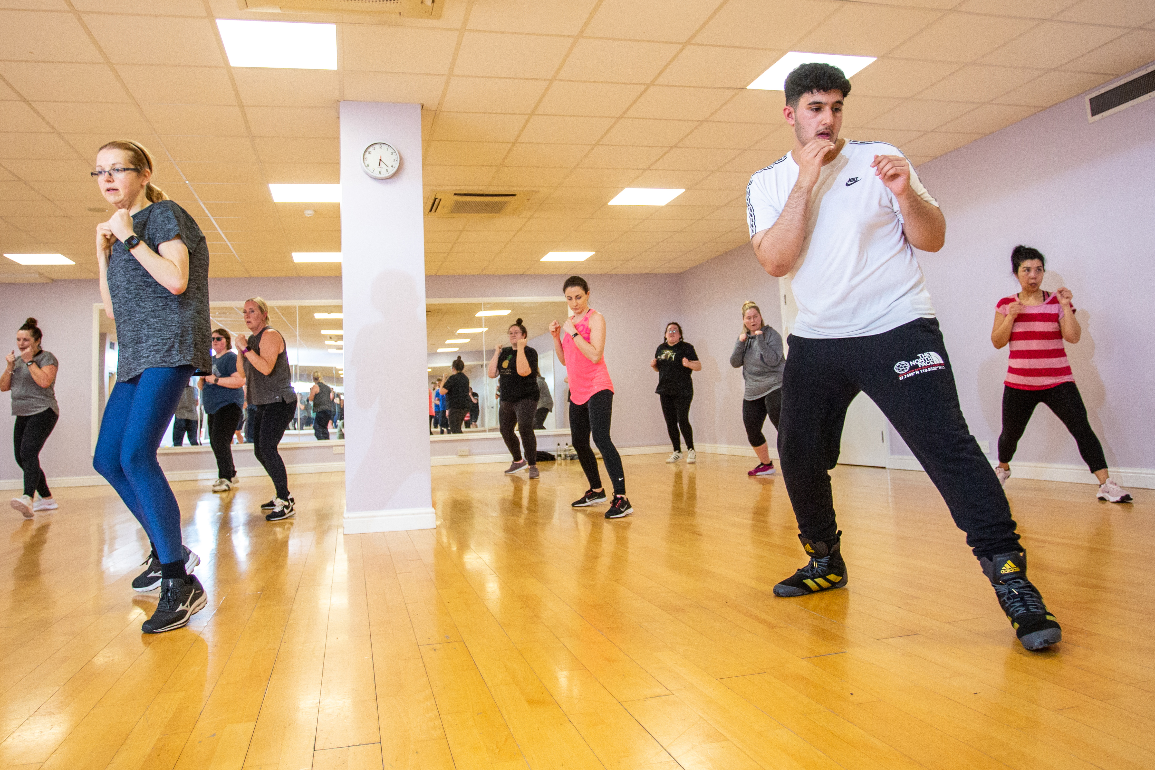 Men and women taking part in a fitness class at Castle Leisure Centre