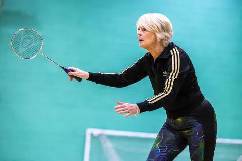 Women playing badminton in the sports hall