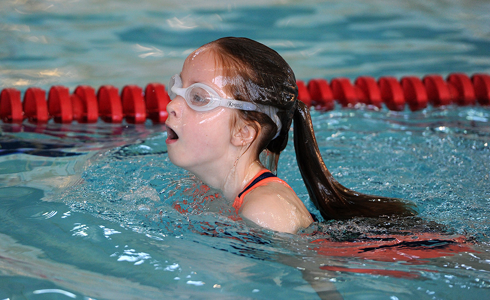 Girl swimming breast stroke