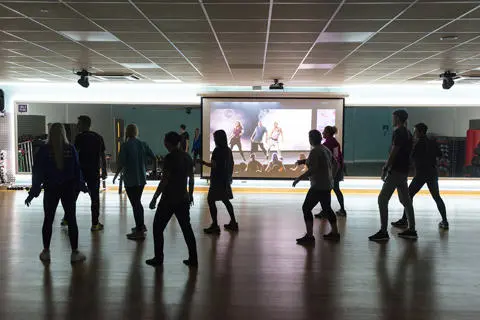 Group taking part in a Les Mills virtual fitness class