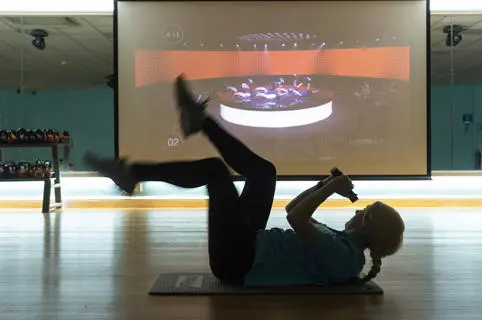 Woman taking part in a virtual fitness class