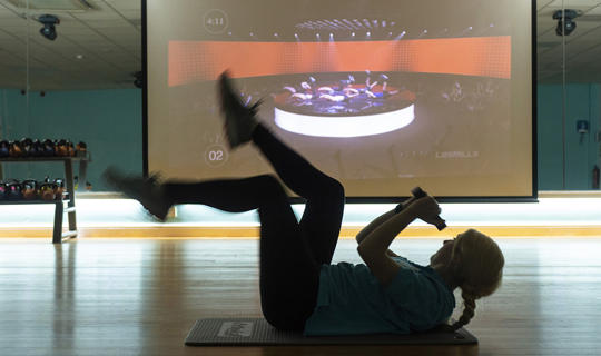 Woman taking part in a virtual fitness class